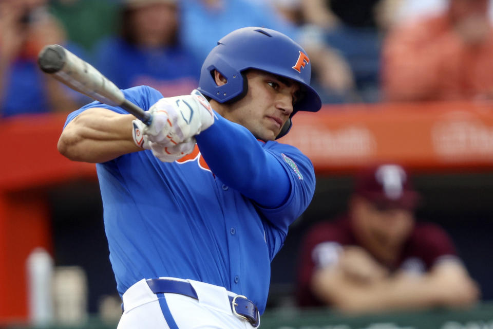 FILE - Florida's Jac Caglianone (14) hits a single in the first inning of an NCAA baseball game against Texas A&M, Saturday, March 16, 2024, in Gainesville, Fla. Florida, the No. 3 seed in the Stillwater Regional, opens play against second-seeded Nebraska on Friday. Caglianone will start the regional in his usual spot at first base and will pitch Saturday against either host Oklahoma State or Niagara. (AP Photo/Gary McCullough, File)