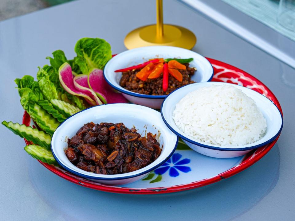 Nam Prik Long Rua, a dish of caramelized pork belly and ground pork with palm sugar, salted egg yolk and crudité, served with jasmine rice.