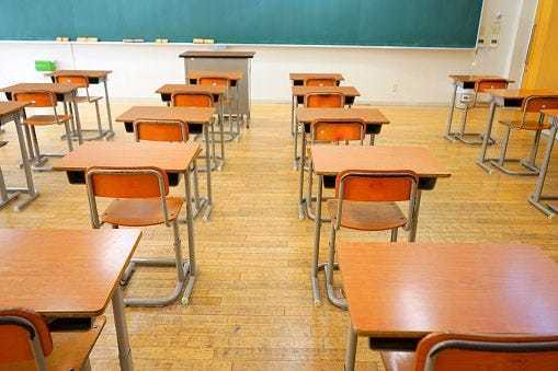 Published Caption: School desks. [Stock photo]

 Original Caption: School desks.