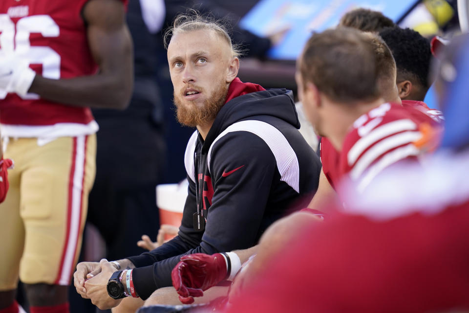 San Francisco 49ers tight end George Kittle watches from the bench during the first half of an NFL preseason football game against the Green Bay Packers in Santa Clara, Calif., Friday, Aug. 12, 2022. (AP Photo/Godofredo A. Vásquez)