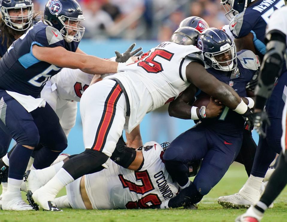 Tennessee Titans quarterback Malik Willis (7) is tackled by Tampa Bay Buccaneers defensive tackle Deadrin Senat (95) during the first quarter of a preseason game at Nissan Stadium Saturday, Aug. 20, 2022, in Nashville, Tenn. 