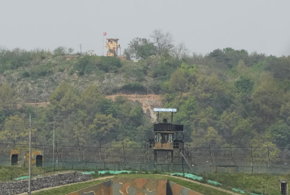 FILE - North Korean military guard posts, rear, and South Korea posts, bottom, are seen in Paju near the border with North Korea, South Korea on April 26, 2022. North Korea’s possible decision to deploy tactical nuclear weapons along its border with South Korea that could reach Seoul and U.S. forces stationed in the country in minutes could be a game changer in the standoff between Kim Jong Un and the United States. (AP Photo/Ahn Young-joon, File)