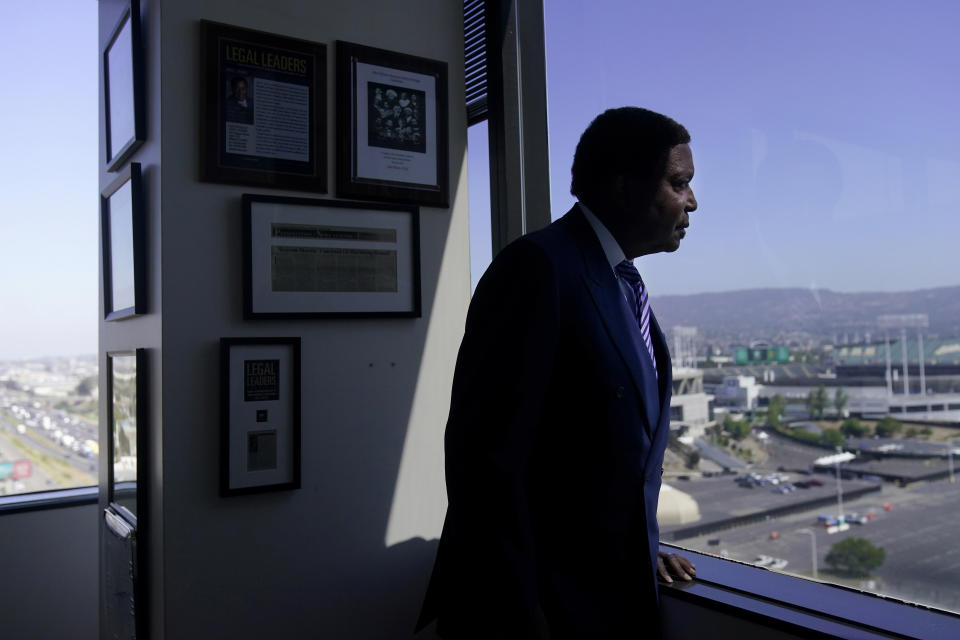 Attorney John Burris poses for photos at his office in Oakland, Calif., Tuesday, Aug. 16, 2022. For nearly 50 years, Burris has poked holes into narratives that did not add up, namely those of law enforcement accused of using excessive force. (AP Photo/Jeff Chiu)