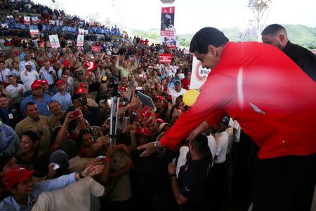 Venezuela's President Nicolas Maduro (R) greets workers during a meeting at the Francisco de Miranda hydroelectric complex in Caruachi, Venezuela July 6, 2017. Miraflores Palace/Handout via REUTERS