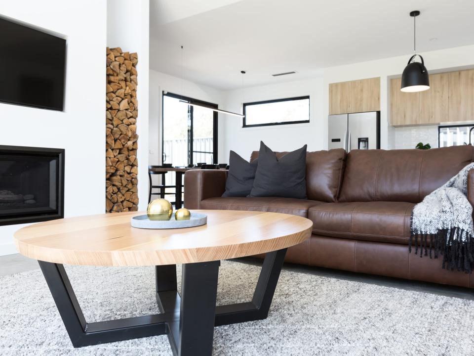 Luxury living room with leather sofa and oak coffee table