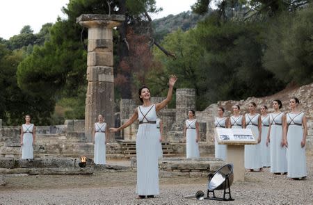 Olympics - Lighting Ceremony of the Olympic Flame Pyeongchang 2018 - Ancient Olympia, Olympia, Greece - October 24, 2017 Greek actress Katerina Lehou, playing the role of High Priestess during the Olympic flame lighting ceremony for the Pyeongchang 2018 Winter Olympics REUTERS/Alkis Konstantinidis