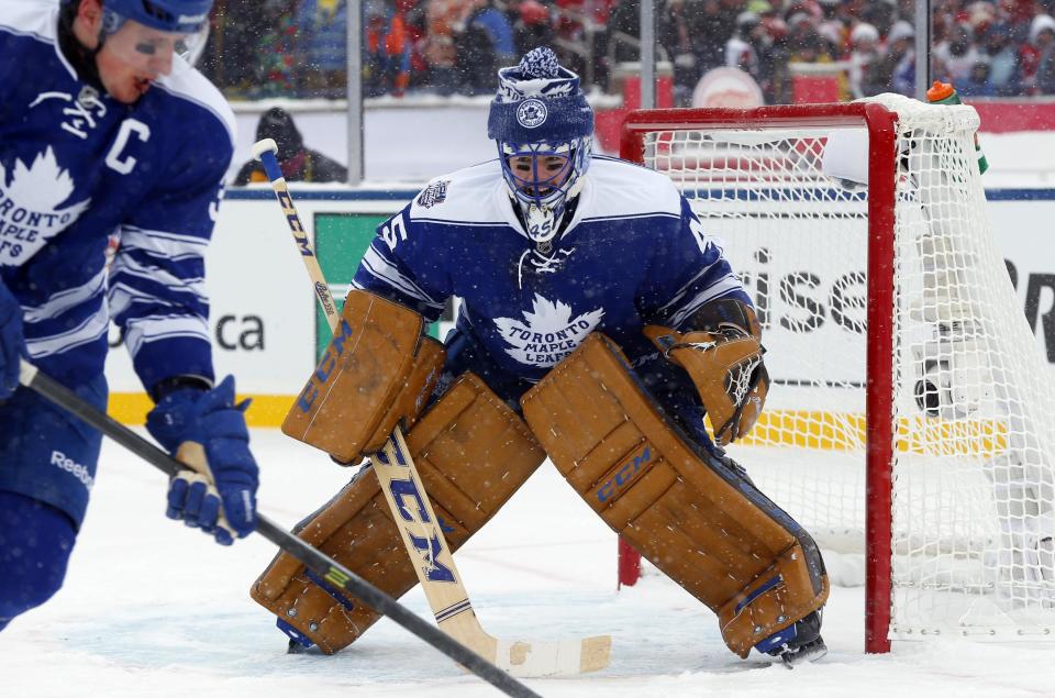 Toronto Maple Leafs goalie Jonathan Bernier (45) guards the net during the second period of the Winter Classic outdoor NHL hockey game against the Detroit Red Wings at Michigan Stadium in Ann Arbor, Mich., Wednesday, Jan. 1, 2014. (AP Photo/Paul Sancya)