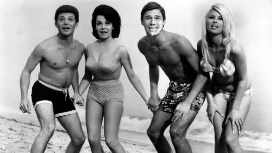 Before Britney Spears and Selena Gomez, Annette Funicello (second from left) rose to fame as a Mouseketeer and Disney Star. Originally, in the first “Beach Party” film, Walt Disney himself requested that she keep her navel covered for modesty. Oh, how times have changed. 