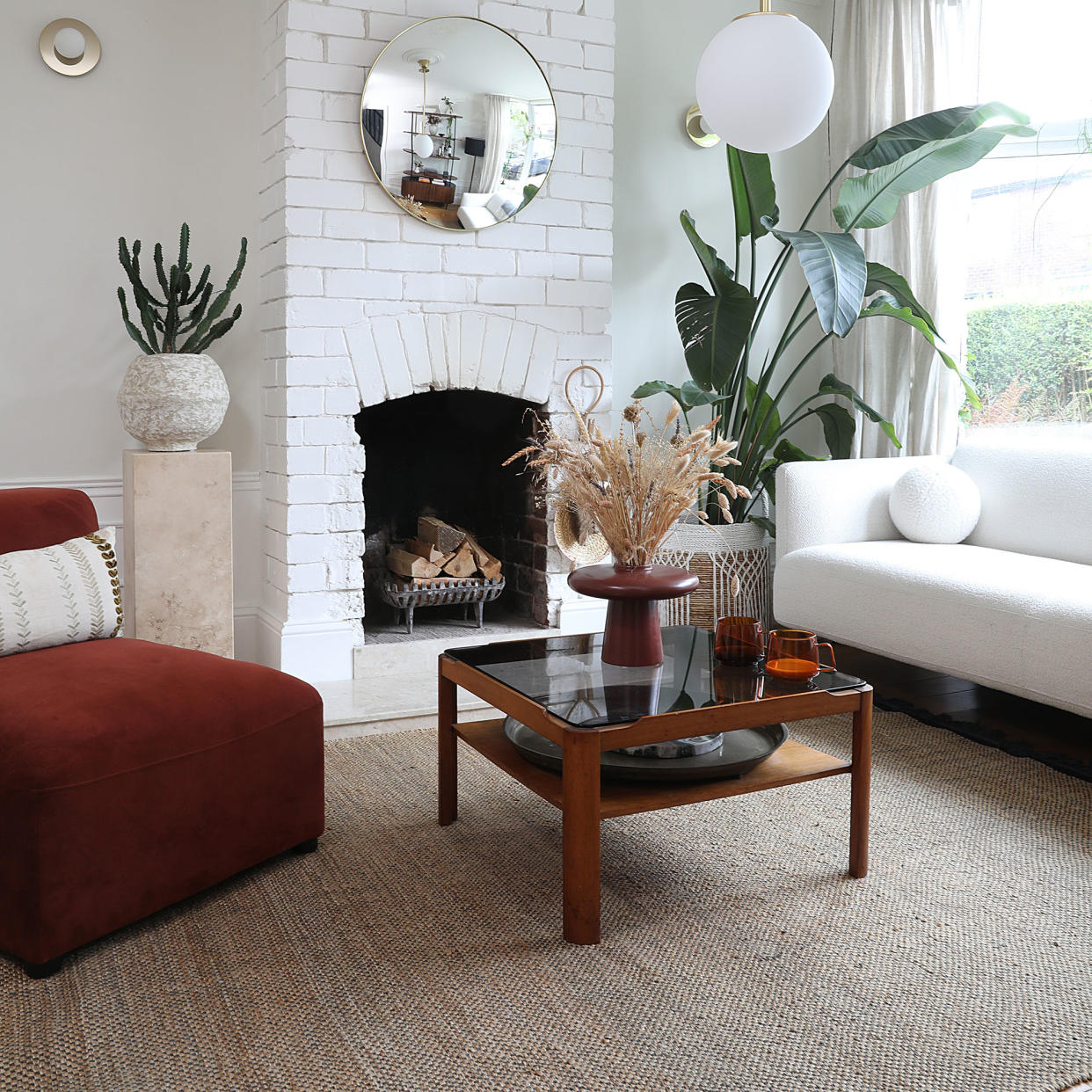  Living room with white sofa and jute rug. 