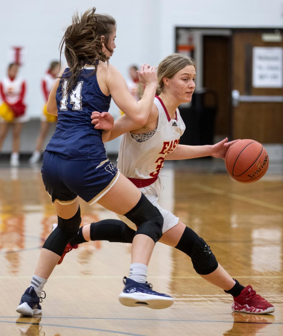 Bullitt East's Lilly Reid drives around Whitefield Academy's Sara Ritter during 24th District Girls tournament action. Feb. 21, 2022
