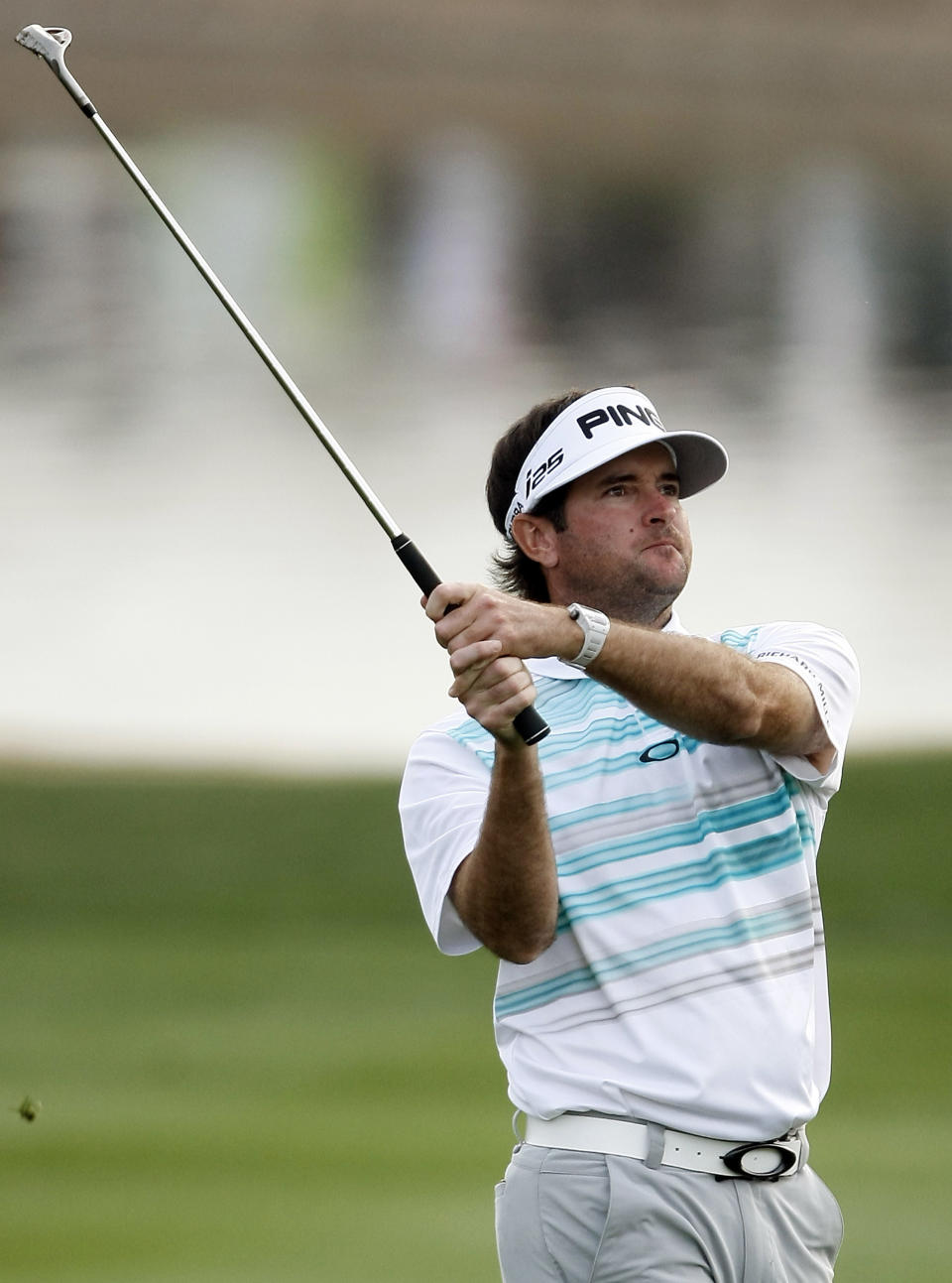 Bubba Watson hits his approach shot on the 18th hole during the first round of the Phoenix Open golf tournament on Thursday, Jan. 30, 2014, in Scottsdale, Ariz. (AP Photo/Rick Scuteri)