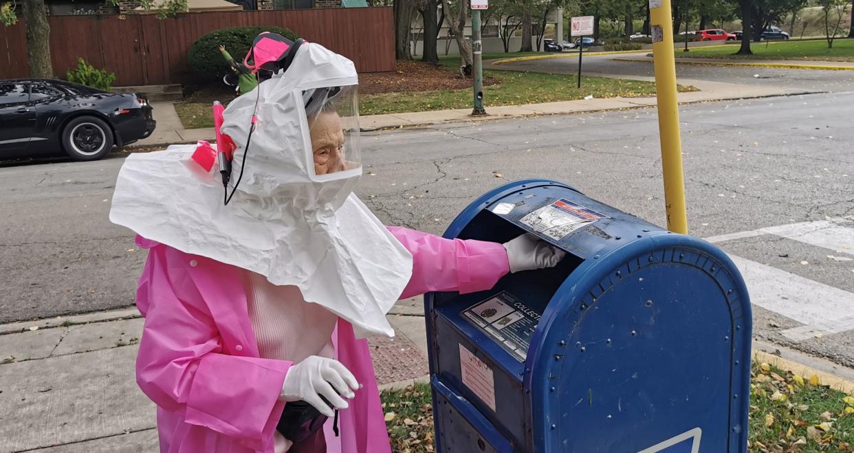 Beatrice Lumpkin, a 102-year-old former teacher, casts her mail-in ballot in Chicago.