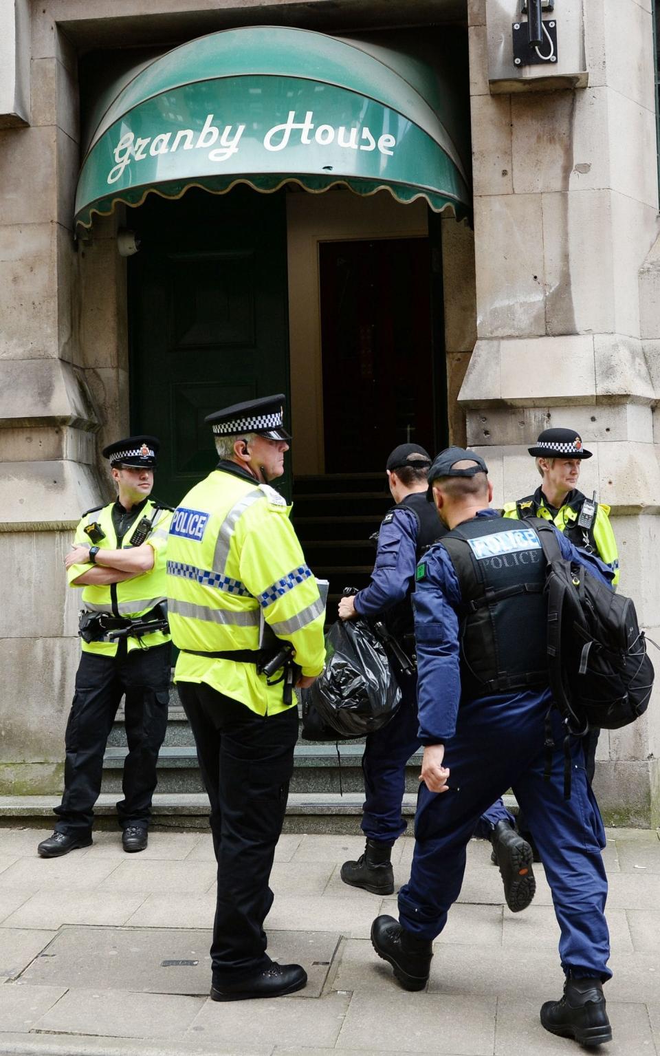 Police from the Tactical Aid Unit enter Granby House - Credit: Ben Birchall/PA