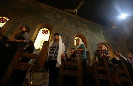 Relatives of the Christian victims of the crashed EgyptAir flight MS804 attend an absentee funeral mass at the main Cathedral in Cairo, Egypt, May 22, 2016. REUTERS/Mohamed Abd El Ghany