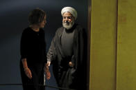 Iran's President Hassan Rouhani, escorted by protocol, arrives to address the 74th session of the United Nations General Assembly, Wednesday, Sept. 25, 2019. (AP Photo/Richard Drew)