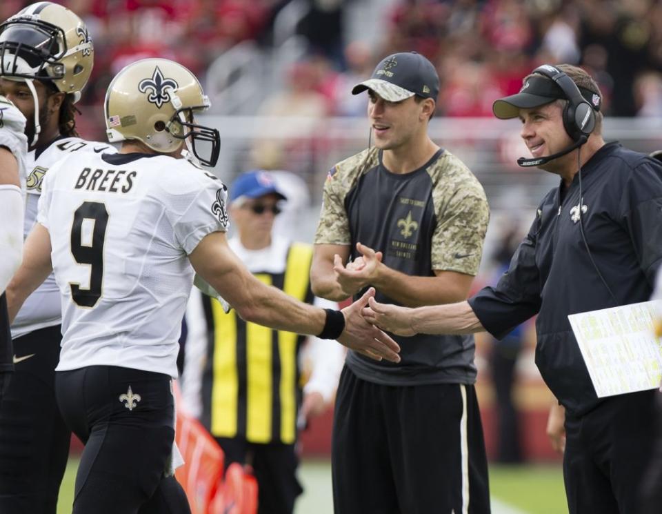 Nov 6, 2016; Santa Clara, CA, USA; New Orleans Saints quarterback Drew Brees (9) high fives head coach Sean Payton on the sideline after Saints touchdown against the San Francisco 49ers during the fourth quarter at Levi's Stadium. The New Orleans Saints defeated the San Francisco 49ers 41-23. Mandatory Credit: Kelley L Cox-USA TODAY Sports