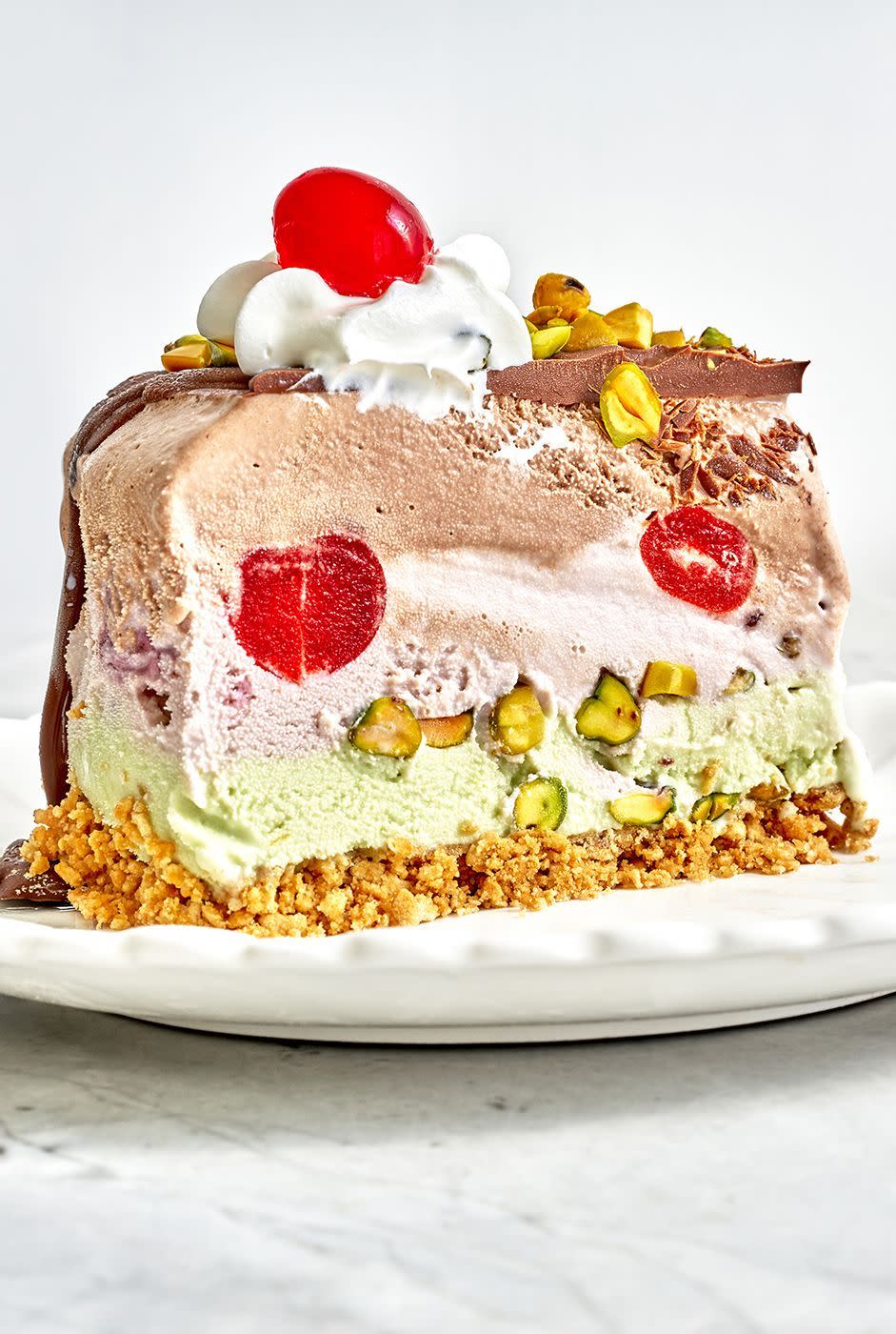 <p>Inspired by the trio of flavors common in Italian <em>spumoni</em>, or molded gelato, this ice cream cake demands attention. With 6 whole pints of <a href="https://www.delish.com/cooking/recipe-ideas/a20730581/homemade-ice-cream-recipe/" rel="nofollow noopener" target="_blank" data-ylk="slk:ice cream;elm:context_link;itc:0;sec:content-canvas" class="link ">ice cream</a>, it feeds a big, hungry crew. </p><p>Get the <strong><a href="https://www.delish.com/cooking/recipe-ideas/a36542396/spumoni-ice-cream-cake-recipe/" rel="nofollow noopener" target="_blank" data-ylk="slk:Spumoni Ice Cream Cake recipe;elm:context_link;itc:0;sec:content-canvas" class="link ">Spumoni Ice Cream Cake recipe</a></strong>. </p>