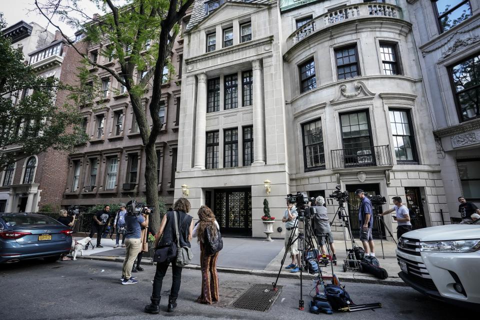 Media gather outside the residence of Ivana Trump, Thursday, July 14, 2022, in New York. Ivana Trump, the first wife of former President Donald Trump and mother of his oldest children, has died in New York City, her family announced Thursday. She was 73. (AP Photo/Mary Altaffer)