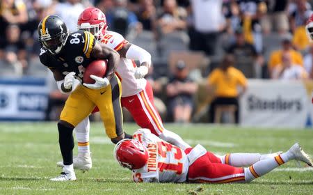 Sep 16, 2018; Pittsburgh, PA, USA; Pittsburgh Steelers wide receiver Antonio Brown (84) returns a free kick against Kansas City Chiefs defensive back Armani Watts (25) and wide receiver De'Anthony Thomas (13) during the fourth quarter at Heinz Field. Kansas City won 42-37. Mandatory Credit: Charles LeClaire-USA TODAY Sports