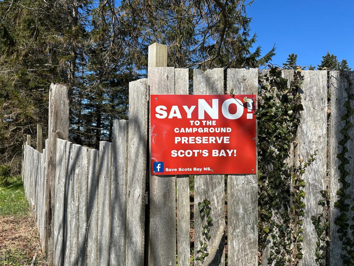 A sign posted on a property in Scots Bay, N.S., calling for a proposed campground to be rejected by the Municipality of Kings County. (Taryn Grant/CBC - image credit)