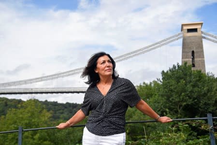 Anna Amato stands for a portrait beside the Clifton Suspension Bridge in Bristol, Britain