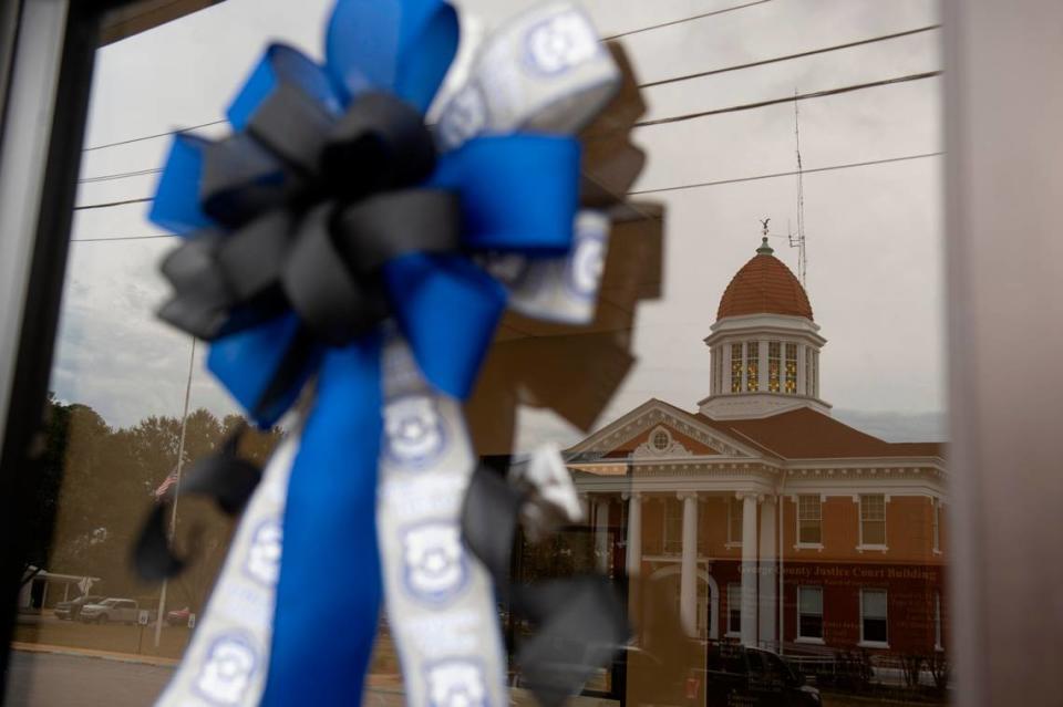 Ribbons hang across from administrative buildings in Lucedale on Friday, Jan. 5, 2024, in honor of Jeremy Malone, an officer with the George County Sheriff’s Department that was killed on Thursday.