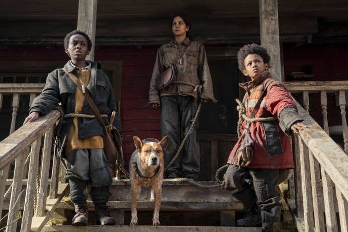 Anthony B. Jenkins, Halle Berry, and Percy Daggs IV standing on a porch with a dog in "Never Let Go"