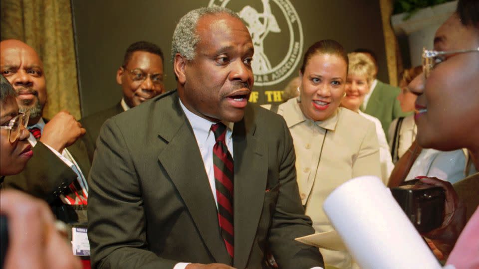 Justice Clarence Thomas signs autographs in Memphis on July 29, 1998, after addressing the National Bar Association, an organization of Black lawyers. - John L. Focht/AP