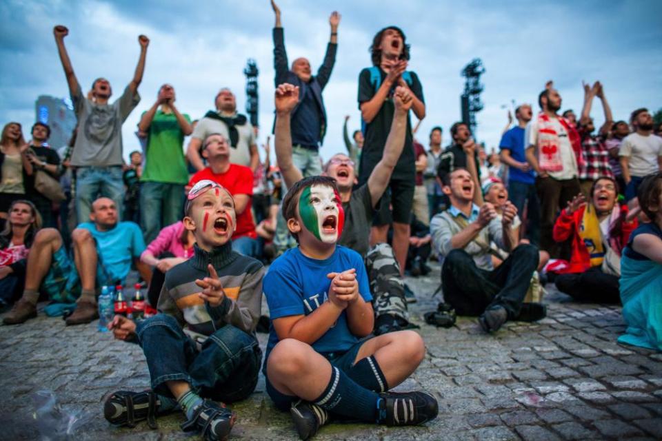 Italy fans cheer in the Warsaw fanzone during their semi-final against Germany at Euro 2012.