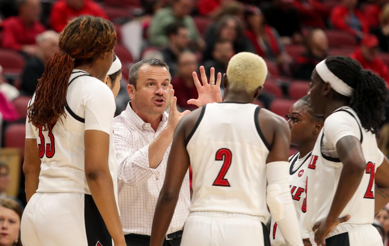 Louisville's Jeff Walz talks to his team during a break in the action against Central Michigan on Nov. 14, 2019.