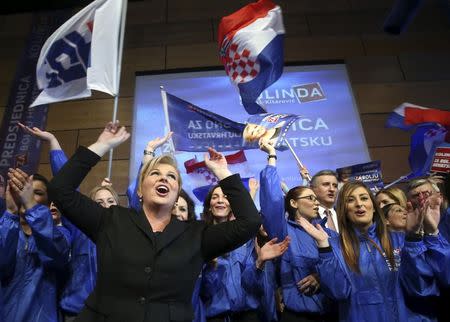 Presidential candidate of Croatian Democratic Union (HDZ) party Kolinda Grabar Kitarovic celebrate with her supporters after unofficial results in Zagreb December 28, 2014. REUTERS/Stringer