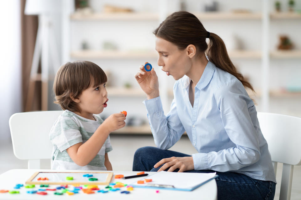 A speech pathologist working with a child