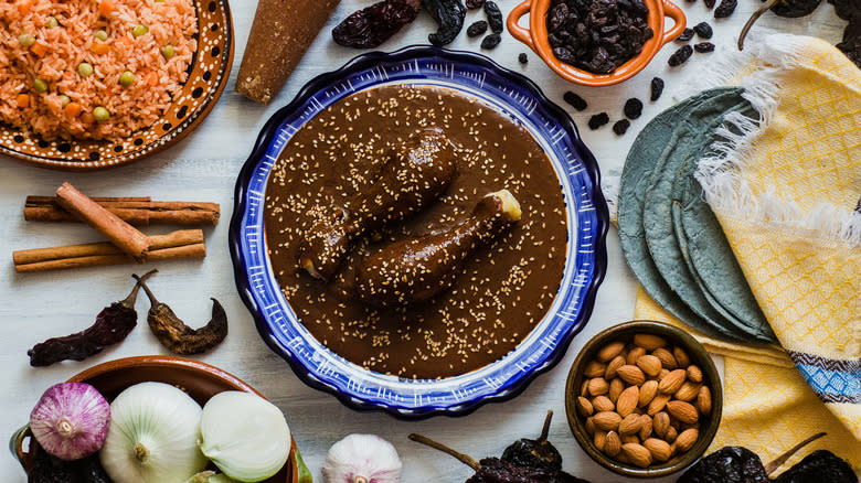 Mole poblano surrounded by food