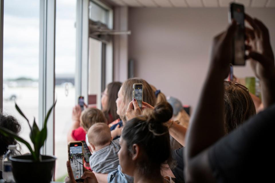 Kids and other family members watch and welcome 60 soldiers from the Indiana National Guard 76th Infantry Brigade Combat Team from their deployment in Kosovo at Atlantic Aviation in South Bend on Thursday, July 13, 2023.