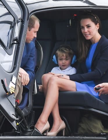 <p>Samir Hussein/WireImage</p> Prince William, Prince George and Kate Middleton sit in a helicopter at the Royal International Air Tattoo at RAF Fairford in July 2016.