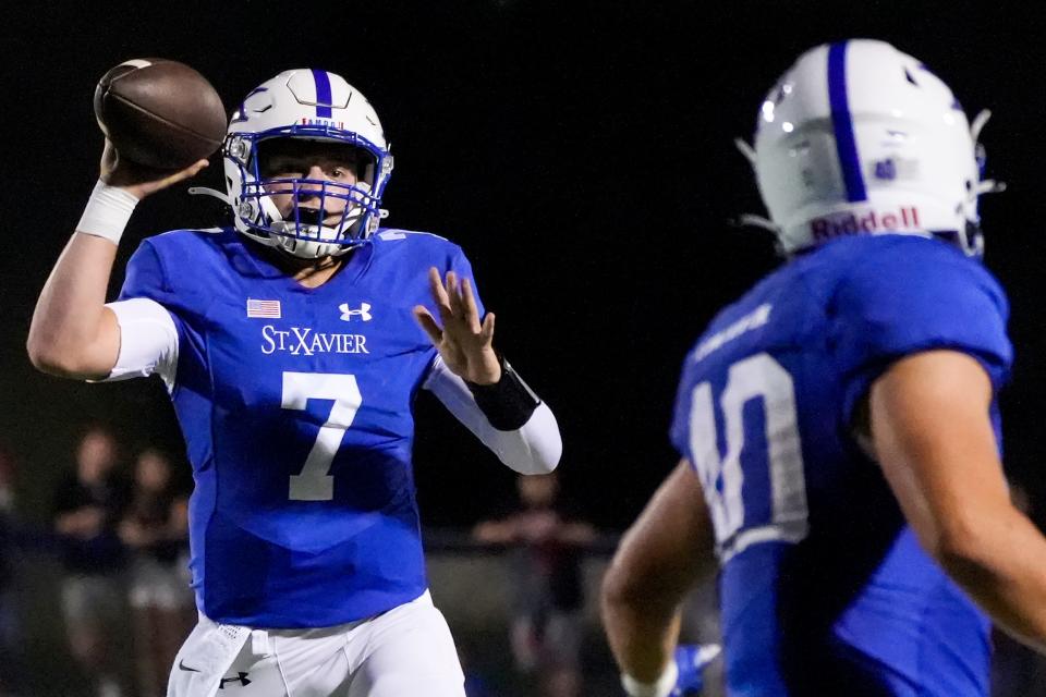 St. Xavier quarterback Chase Herbstreit (7) prepares to make a pass during the opening weekend football game between St. Xavier High School and Lakota West High School on Friday, Aug. 18, 2023 at RDI Stadium & Ballaban Field at St. Xavier High School. St. Xavier won 10-0.
