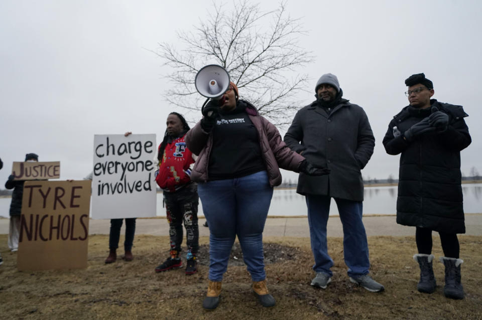 Amber Sherman of the group Decarcerate Memphis speaks to a group of demonstrators who gathered at dusk in Shelby Farms Park on Monday, Jan. 30, 2023, in Memphis, Tenn., in response to the death of Tyre Nichols, who died after being beaten by Memphis police officers. Nichols, who had a hobby in photography, frequented the park to photograph sunsets. (AP Photo/Gerald Herbert)