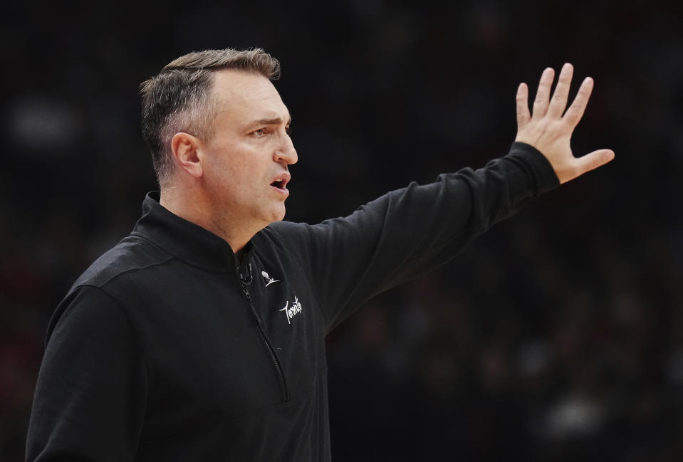 Toronto Raptors head coach Darko Rajakovic instructs his team during the first half of an NBA basketball game against the Minnesota Timberwolves in Toronto on Wednesday, Oct. 25, 2023. (Nathan Denette/The Canadian Press via AP)