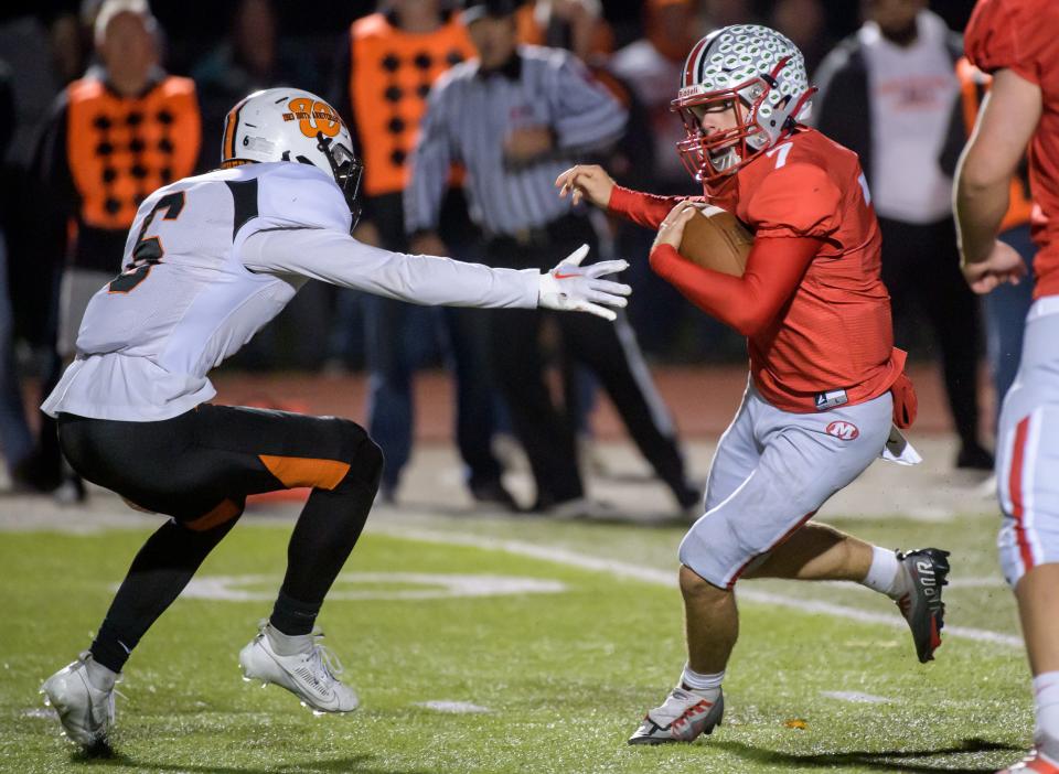 Morton quarterback Jude Hart, right, avoids Washington's Zachary Ryan in the second half of their Week 9 football game against Washington on Friday, Oct. 20, 2023 in Morton.