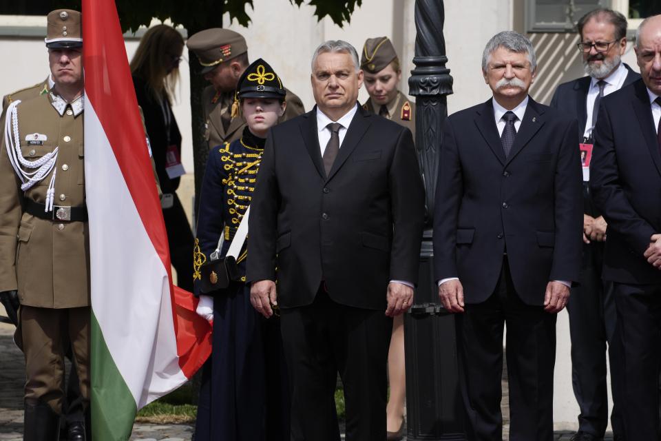 Hungary Prime Minister Viktor Orban, centre, waits for the arrival of Pope Francis in the square of "Sándor" Palace in Budapest, Friday, April 28, 2023. The Pontiff is in Hungary for a three-day pastoral visit. (AP Photo/Andrew Medichini)