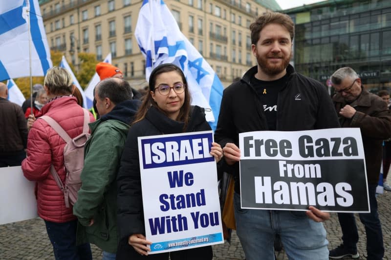 People take part in a pro-Israel protest under the motto 'Together Against Hamas' Crimes Against Israelis and Palestinians,' marking the first anniversary of the October 7 attacks on Israel. Joerg Carstensen/dpa