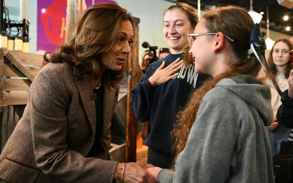 Ms Harris meets supporters on a campaign stop in Pennsylvania where the poll reduced her lead in the overall average of polls to just 0.3 per cent