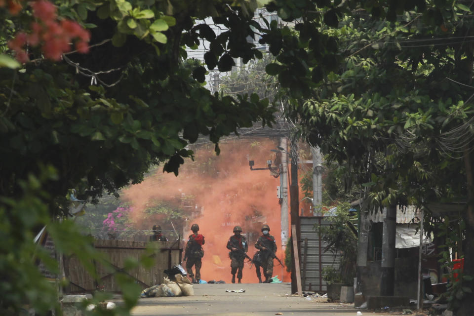 Soldiers walk towards anti-coup protesters during a demonstration in Yangon, Myanmar on Tuesday March 30, 2021. Thailand’s Prime Minister Prayuth Chan-ocha denied Tuesday that his country’s security forces have sent villagers back to Myanmar who fled from military airstrikes and said his government is ready to shelter anyone who is escaping fighting. (AP Photo)