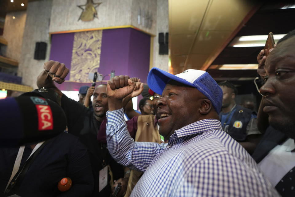 Supporters of President Emmerson Mnangagwa celebrate after he was declared the winner by the Zimbabwe Electoral Commission in Harare, Zimbabwe, on Saturday, Aug. 26, 2023. This would be Mnangagwa's second and final five year term after winning disputed polls in 2018. (AP Photo/Tsvangirayi Mukwazhi)