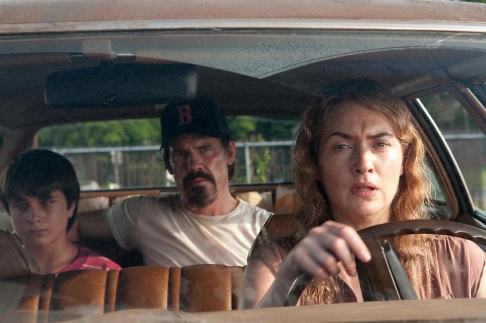 This image released by Paramount Pictures shows Gattlin Griffith, left, Josh Brolin and Kate Winslet in a scene from "Labor Day." (AP Photo/Paramount Pictures, Dale Robinette)