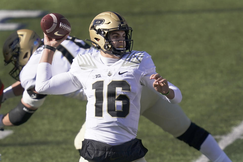 Purdue quarterback Aidan O'Connell passes during the first half of an NCAA college football game against Illinois Saturday, Oct. 31, 2020, in Champaign, Ill. (AP Photo/Charles Rex Arbogast)