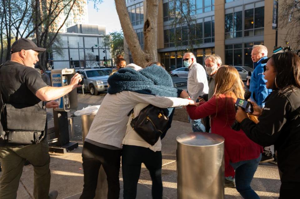 Sherri Papini is surrounded by family members after leaving the Sacramento County Main Jail on Tuesday, March 8, 2022. Papini, the Redding woman whose alleged kidnapping in November 2016 sparked national searches and tabloid media coverage, spent five nights in the jail after being arrested and charged with wire fraud and lying to federal agents about the abduction.