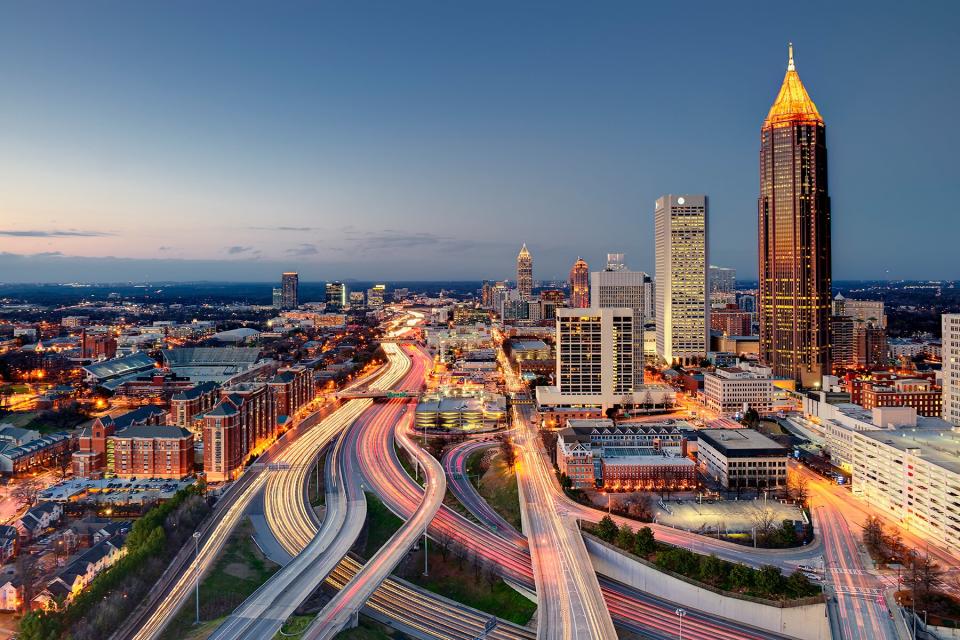 The midtown skyline and interstate highway system as it merges into downtown Atlanta in the late evening