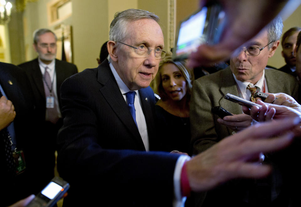 Senate Majority Leader Sen. Harry Reid, D-Nev., is surrounded by reporters after leaving the office of Senate Minority Leader Sen. Mitch McConnell, R-Ken., on Capitol Hill on Monday, Oct. 14, 2013 in Washington. (AP Photo/ Evan Vucci)