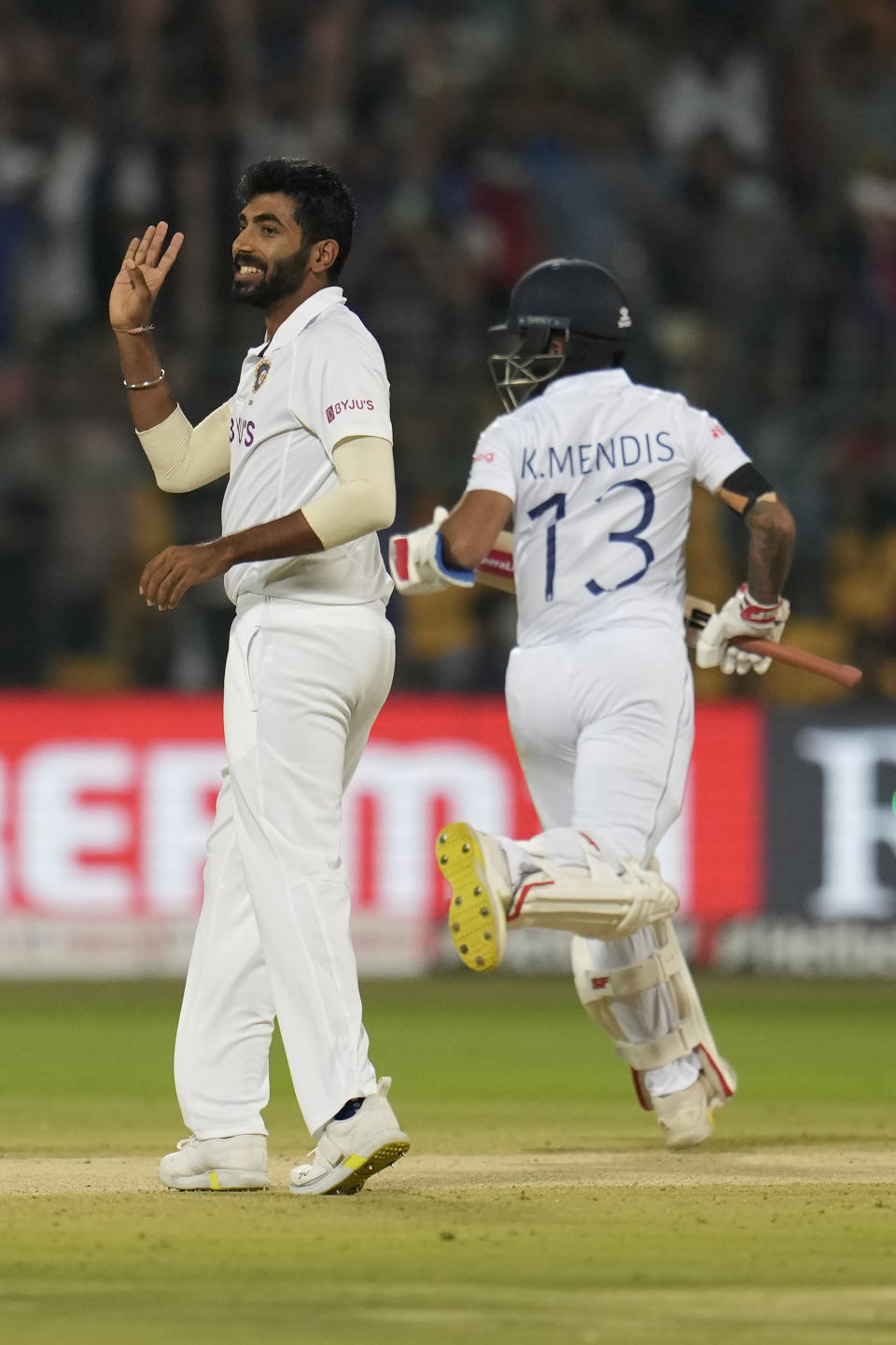 India's Jasprit Bumrah, left, reacts after bowling a delivery to Sri Lanka's Kusal Mendis, right, during the second day of the second cricket test match between India and Sri Lanka in Bengaluru, India, Sunday, March 13, 2022. (AP Photo/Aijaz Rahi)